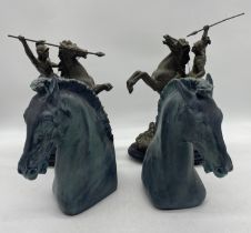 A pair of spelter figures on horseback (1 A/F) along with a pair of resin classically styled