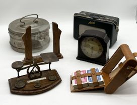 A collection of various items including postal scales, Roberts radio, metal canteen etc.