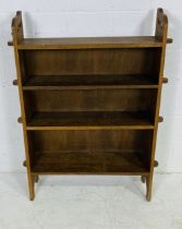 An oak freestanding bookcase - height 117cm, width 90cm, depth 19cm