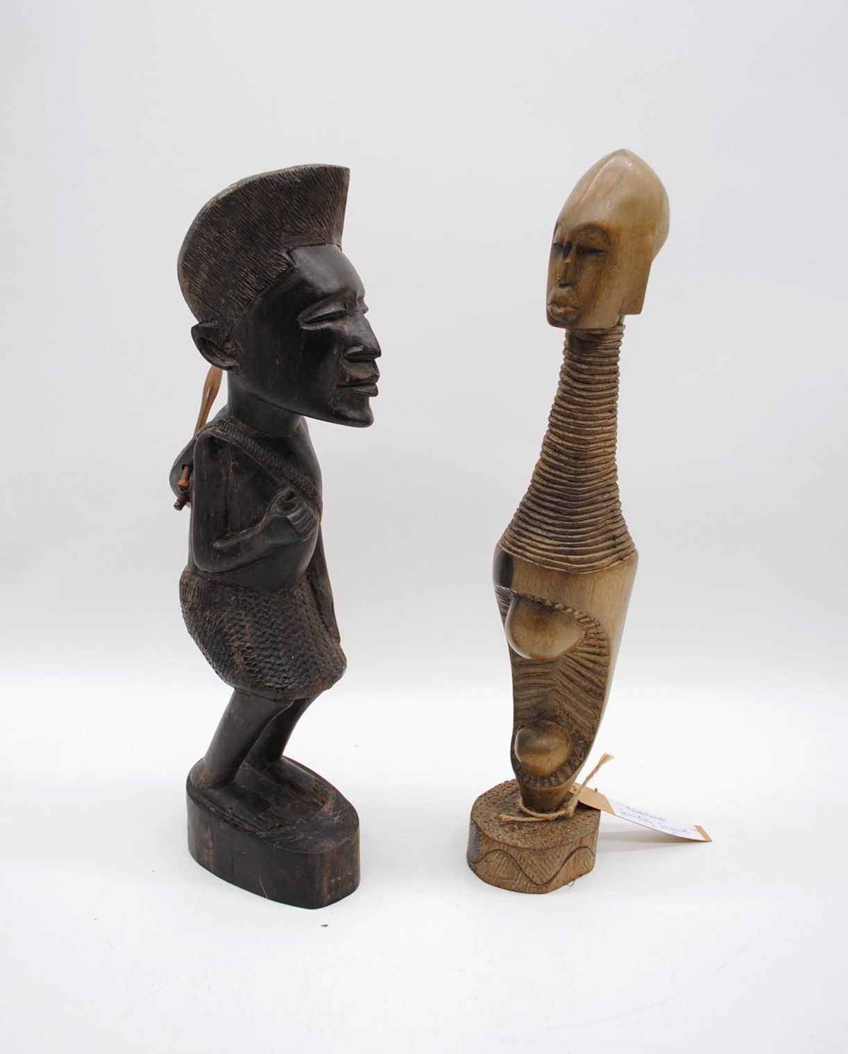 A carved wooden Ndebale fertility figure, along with another carved tribal figure and two African - Image 2 of 6
