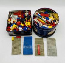 Two tins of vintage Lego