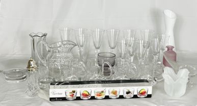 A large collection of glassware including Dartington, art glass vases, goblets etc. over 4 shelves