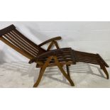 A teak steamer chair with removable footrest, one fixing missing