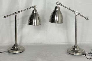 A pair of chrome Anglepoise style lamps