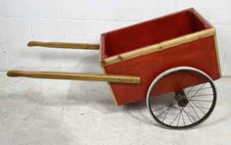 A small wooden painted cart
