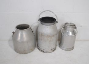 Two galvanised milk churns and one other