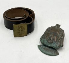 A Victorian brass door knocker in the form of Queen Victoria along with Spanish military belt