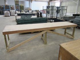 A large industrial wooden workbench