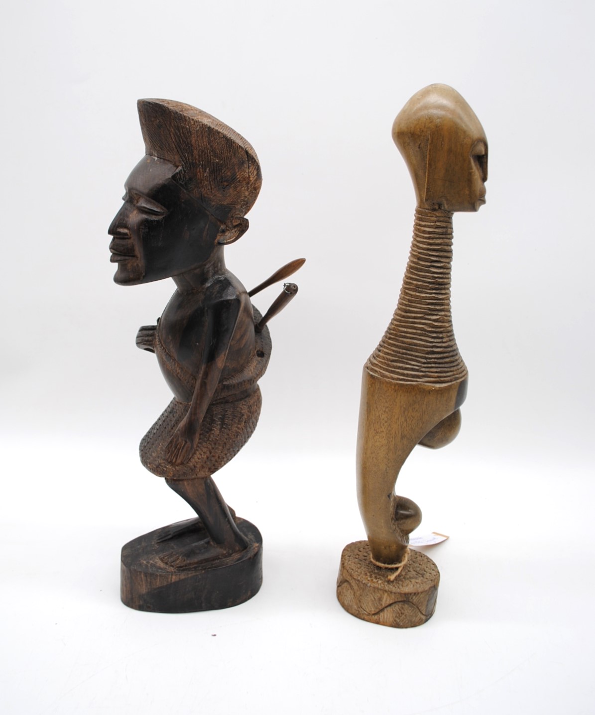 A carved wooden Ndebale fertility figure, along with another carved tribal figure and two African - Image 3 of 6