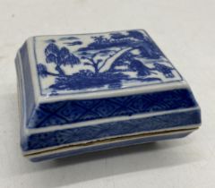 A small Chinese blue and white lidded rectangular pot with six character mark to underside