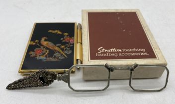 An Art Deco lorgnette along with a Stratton notebook