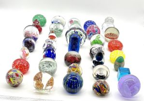A large selection of glass paperweights including Mdina