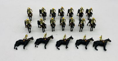 A collection of nineteen unboxed Britains "Black Beauty" horses with riders plastic model