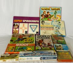 A collection of vintage board games including Pot Shot Football, Magic Robot, Shoot, Marx Arold