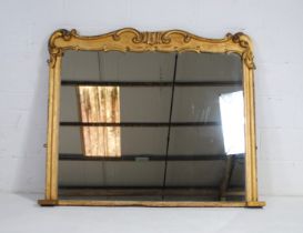 A large antique Rococo style gilt over-mantle mirror - length 143cm, height 119cm
