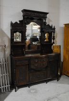 An Edwardian mahogany mirror backed sideboard, with carved detailing and fluted columns - length