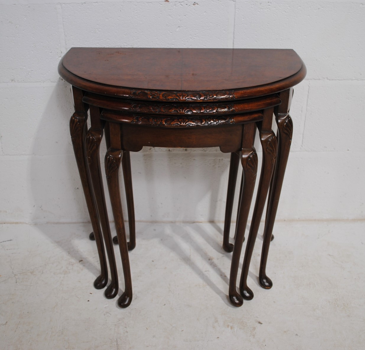 A walnut veneered nest of three demi-lune tables, with carved decoration, raised in cabriole legs - Image 5 of 6