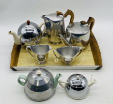 A five-piece Picquot Ware tea service comprising of a teapot, coffee pot, sugar bowl, creamer jug