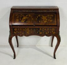 A Dutch marquetry cylinder bureau with floral decoration and single drawer and pull out slide on