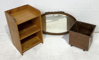 A copper coal bucket along with a small pine bookcase and oval mirror