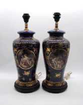 A pair of Classical style ceramic table lamp bases, of blue ground with gilded decoration and