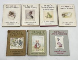 A collection of Beatrix Potter titles including two early examples of Pigling Bland and The Pie