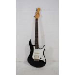 A Yamaha EG 112 black Stratocaster electric guitar