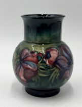 A boxed Moorcroft vase in the Anemone pattern - height 13cm