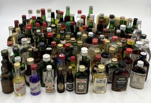A large collection of alcohol miniatures including Lemon Hart Rum, Mount Gay etc.