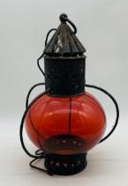 A vintage lantern style metal ceiling pendant with ruby red shade - overall height 48cm