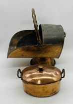 A vintage copper scuttle, along with a lidded copper pot