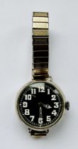 A WWII era hallmarked silver watch with black dial and white Arabic numerals