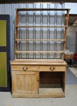 An antique pine dresser - top A/F - length 138cm, depth 50cm