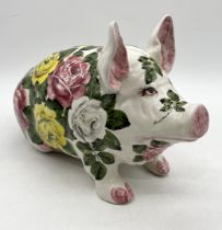 A large Wemyss pig in yellow, white and pink cabbage rose pattern signed to the underside 'Wemyss,