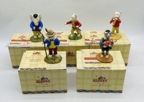 A collection of five boxed The Rupert Bear Collection ceramic figurines by Royal Doulton including