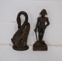 Two cast iron door stops, in the form of the Duke of Wellington and a swan