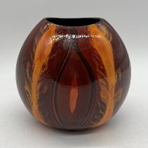 A living glaze Poole pottery purse vase by Sylvia Whitehead - height 18cm