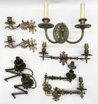 A collection of mainly antique brass candle sconces including three pairs, piano sconces etc.