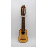 A Charango, marked 'Galeria Musical "Nunez" to the inner body, with soft case