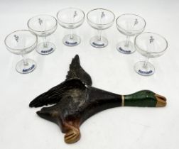 A set of six Babycham glasses along with a plaster flying duck