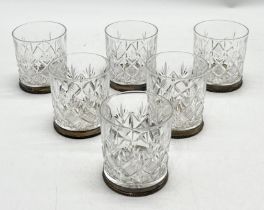A set of six Thomas Webb cut glass tumblers each with hallmarked silver holders