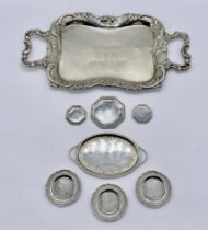 A miniature silver two handled tray along with various miniature silver plates etc.