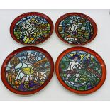 A set of four Poole Pottery plates from the Medieval Calendar Series, designed by Tony Morris.