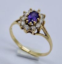 An amethyst cluster ring set in 9ct gold, size Q 1/2