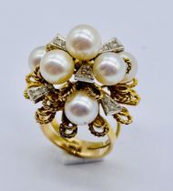 A 14ct gold ring set with diamonds and pearls marked "Sena", size K, total weight 13g