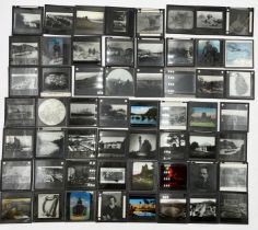 A collection of 56 magic lantern slides on various subjects including ships, travel, maps etc.