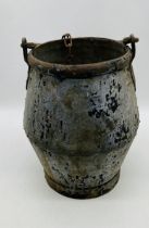 An antique metal well bucket - bucket height 38cm