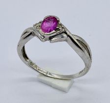 A ruby and diamond ring set in 9ct white gold, size Q