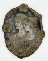 An Art Nouveau style resin plaque titled "Moon Children" by J. Pecorini