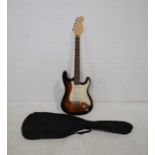 A Dragon traditional sunburst Stratocaster electric guitar, with soft case